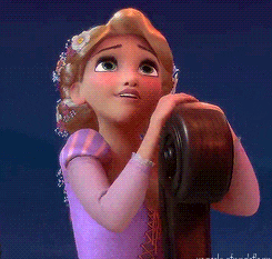 a gif of rapunzel longingly looking into the sky while on a boat in the movie tangled