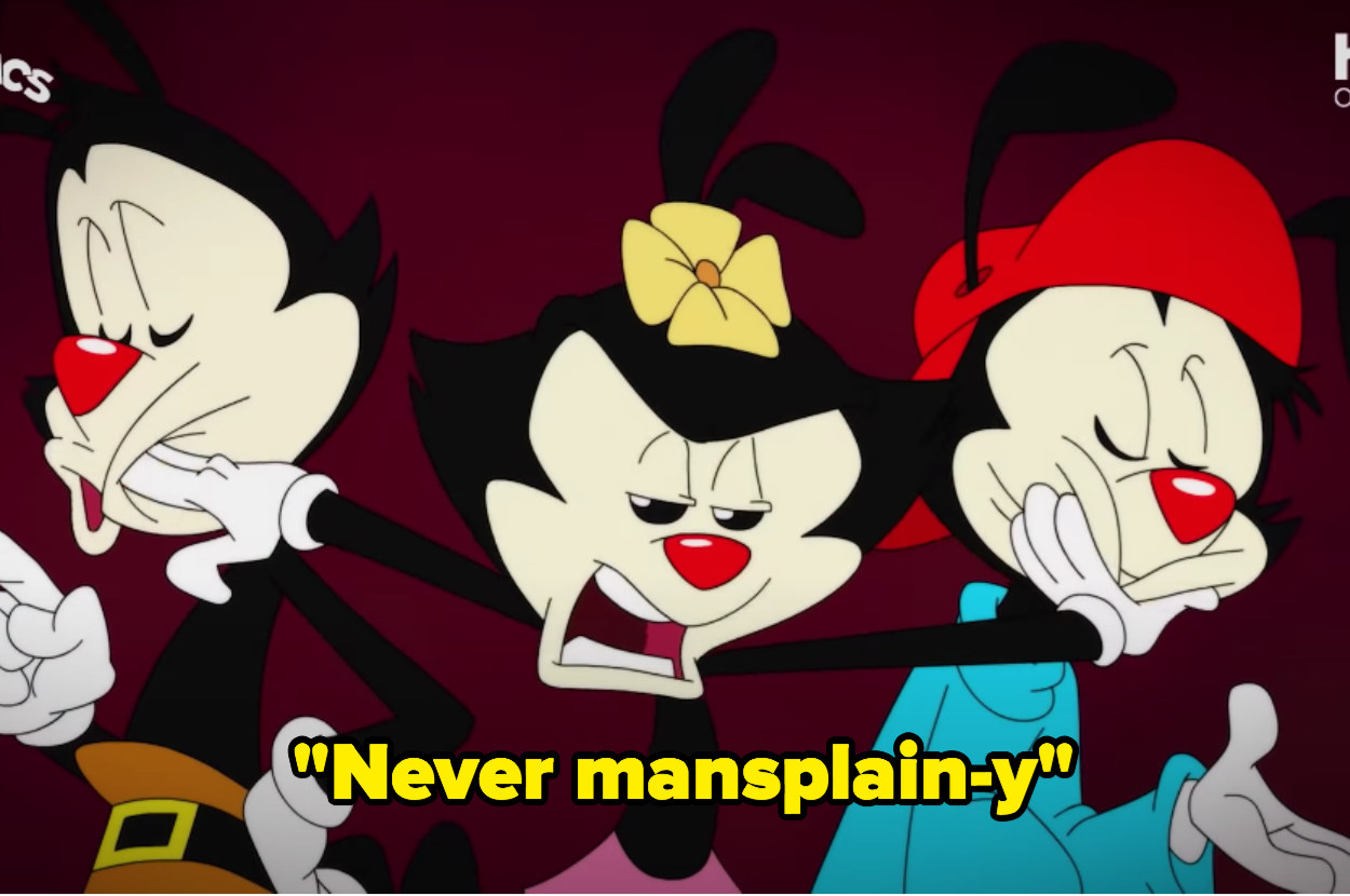 A screenshot of Dot pushing Yakko and Wakko&#x27;s faces to the side while singing &quot;Never mansplain-y&quot; 
