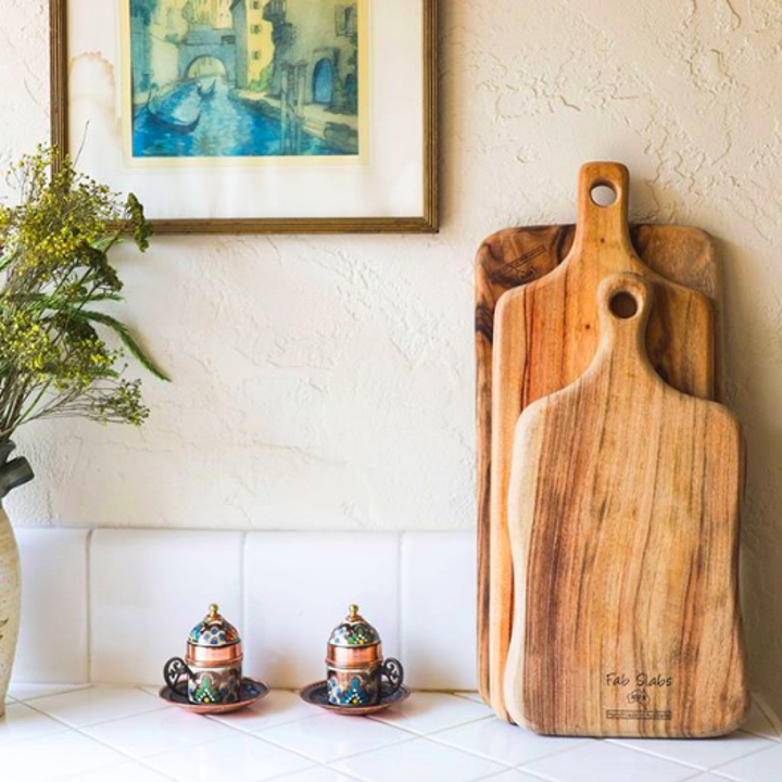 Three cutting boards on display in kitchen 
