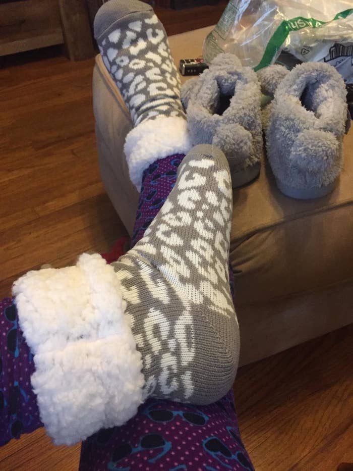 Reviewer in the grey leopard print socks with sherpa cuff