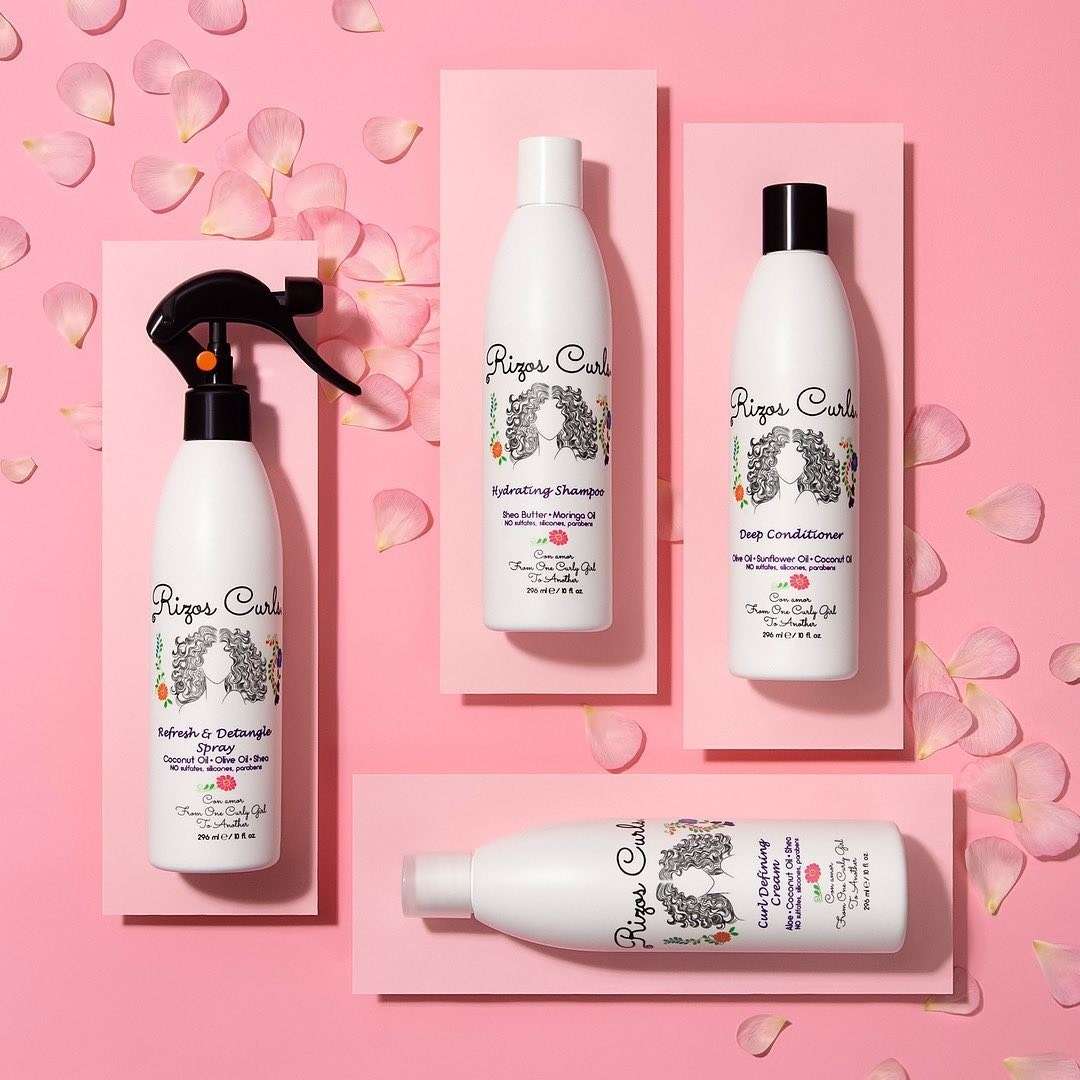Rizos Curls products on pink background