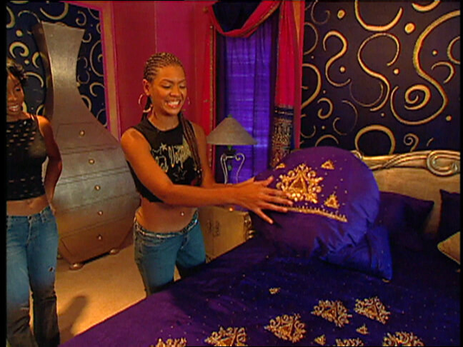 A screenshot of Beyonce showing off her colorful room on MTV Cribs