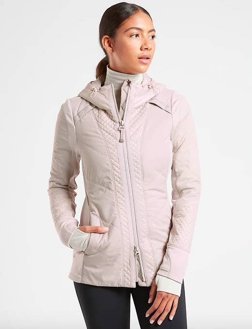 A model wears the rock ridge prima loft jacket in abalone grey