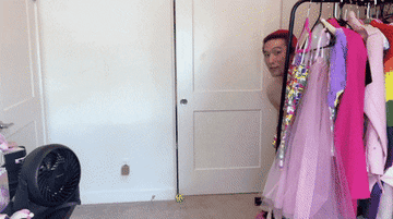 A gif of one one of the testers revealing themselves in the jumpsuit