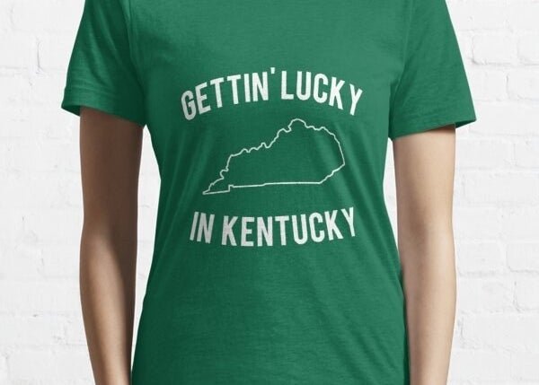 A woman wearing a &quot;Gettin&#x27; Lucky In Kentucky&quot; T-shirt