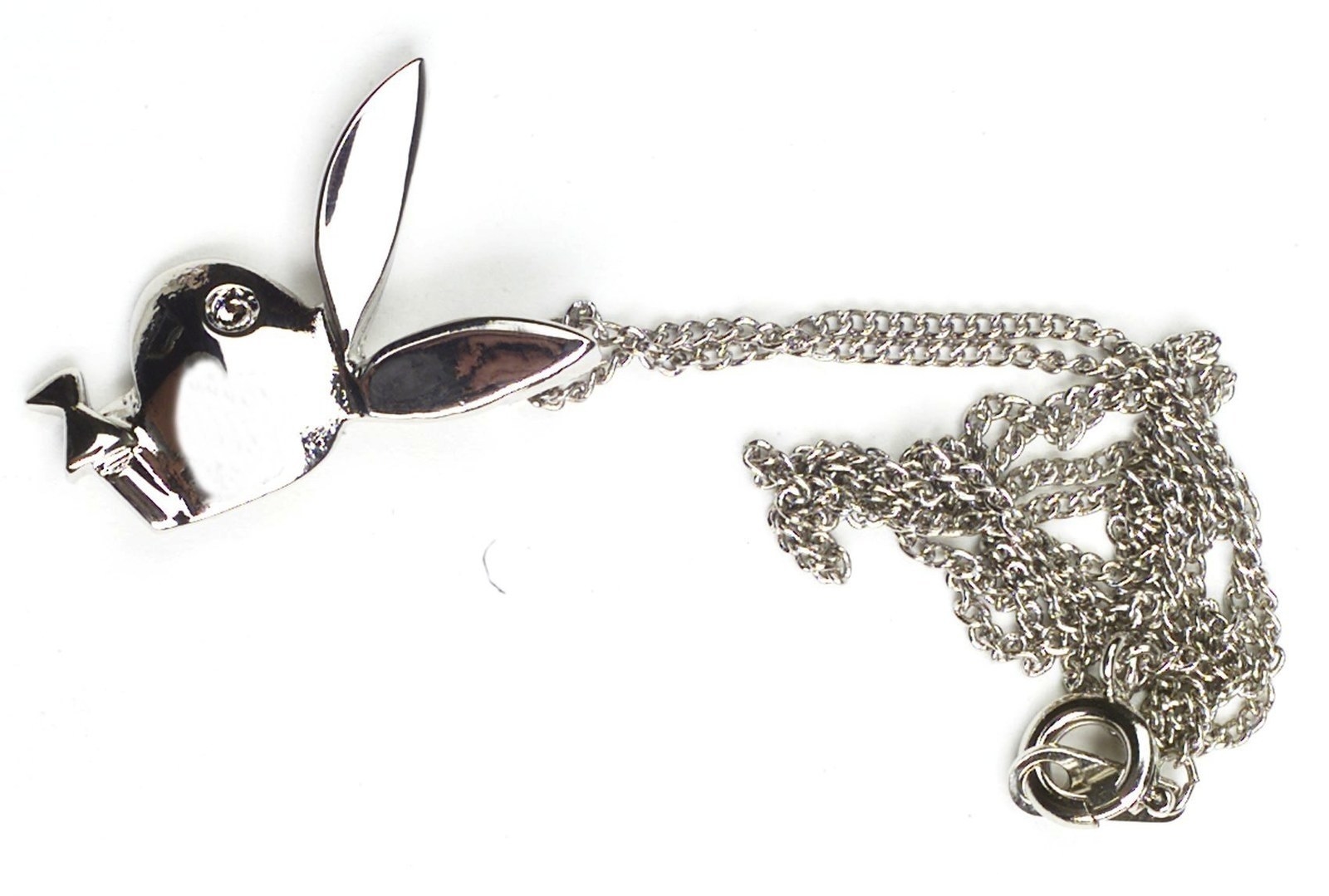 A photo of a silver Playboy Bunny necklace