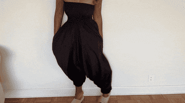 A gif of one of the testers dancing in the jumpsuit.