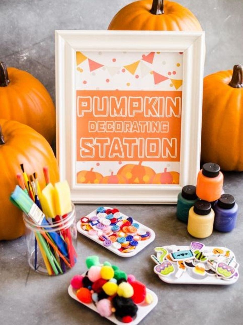 table with mini pumpkins to paint for an activity