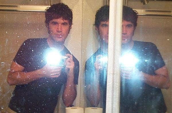 A photo of Myspace Tom taking a selfie with the flash going off