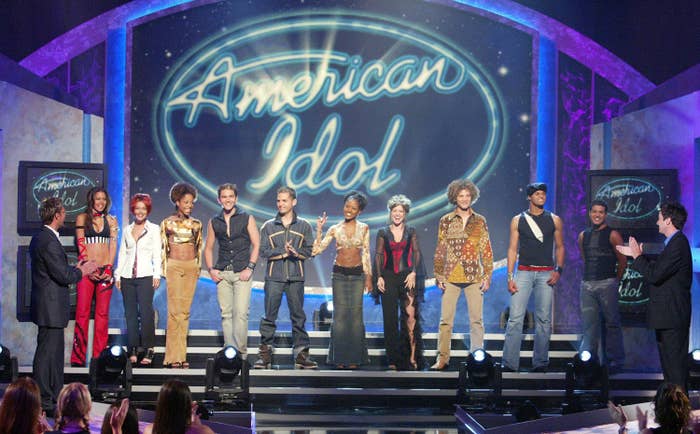 The American Idol top 10 finalist standing onstage 
