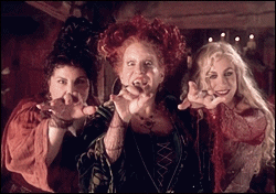 Kathy Najimy, Bette Midler, and Sarah Jessica Parker in the movie &quot;Hocus Pocus&quot; with evil smiles and moving their hands