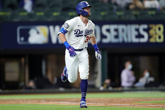 Cody Bellinger, #35 of the Los Angeles Dodgers, watches the flight of his two-run home run in the fourth inning during Game 1 of the 2020 World Series between the Los Angeles Dodgers and the Tampa Bay Rays.
