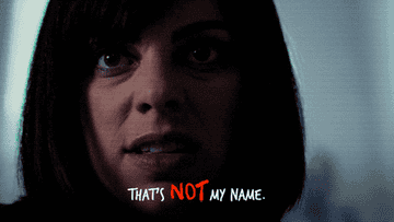 Close up of a woman saying &quot;That&#x27;s not my name&quot;