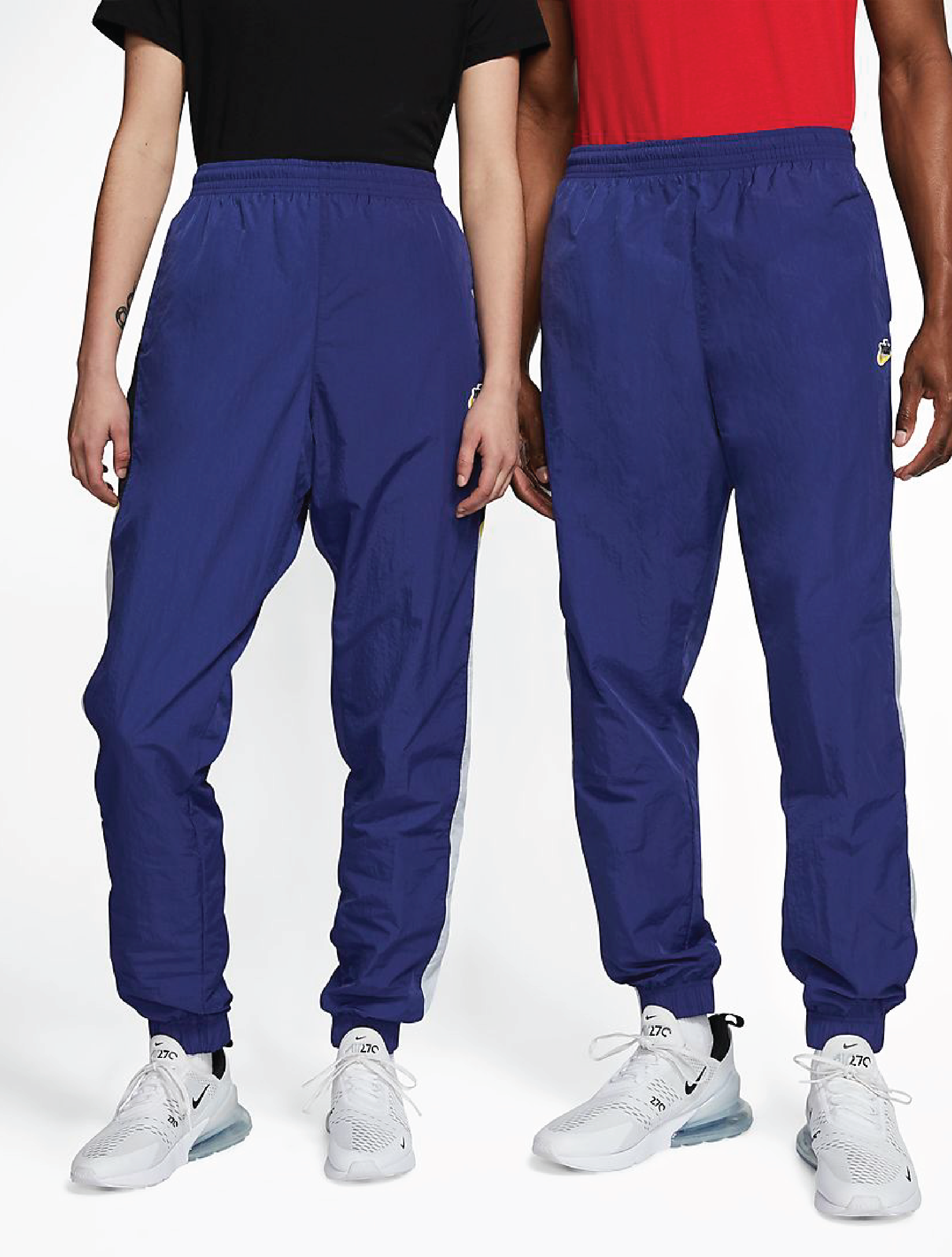 Two models wearing the blue pants with sneakers