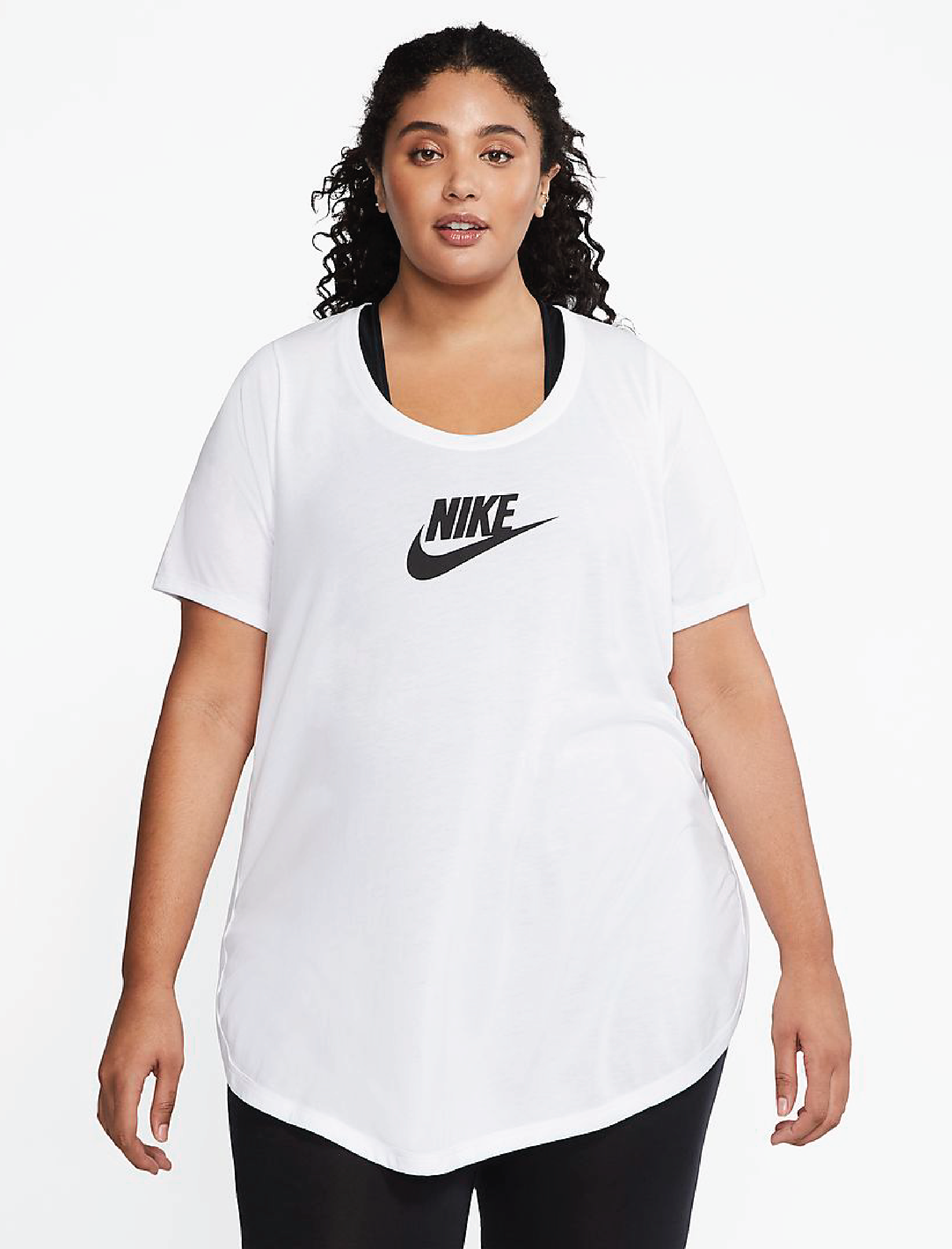 A model wearing the tunic in white with the black Nike logo and swoosh in the center
