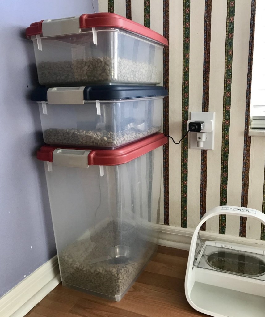 Storage containers with cat food stacked on top of each other