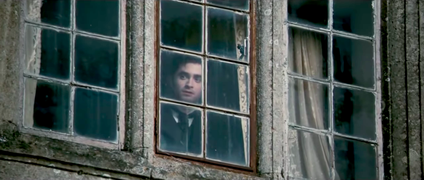 Daniel Radcliffe looking out a window in The Woman in Black