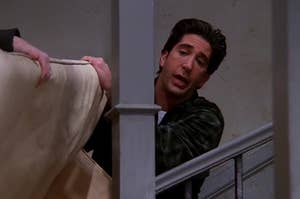 Ross trying to get a couch up the stairs 