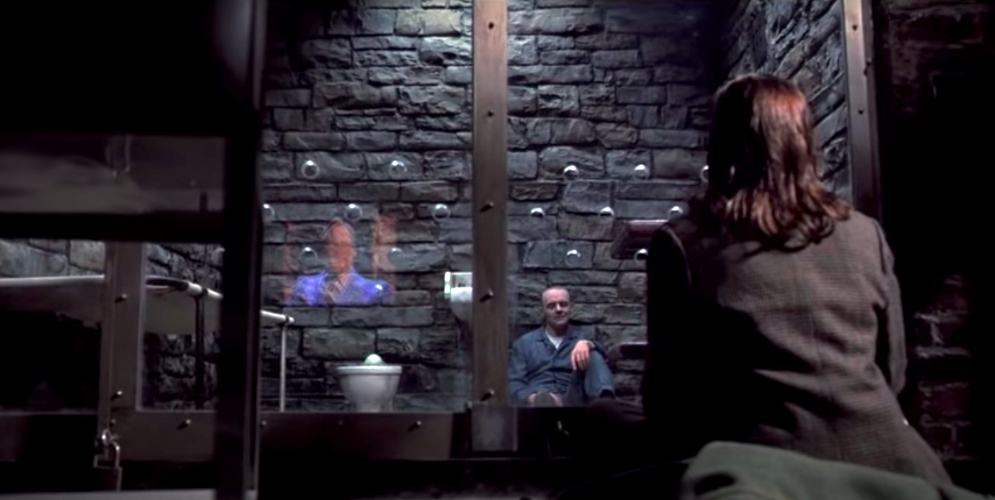 Anthony Hopkins in a prison cell with Jodie Foster outside in Silence of the Lambs