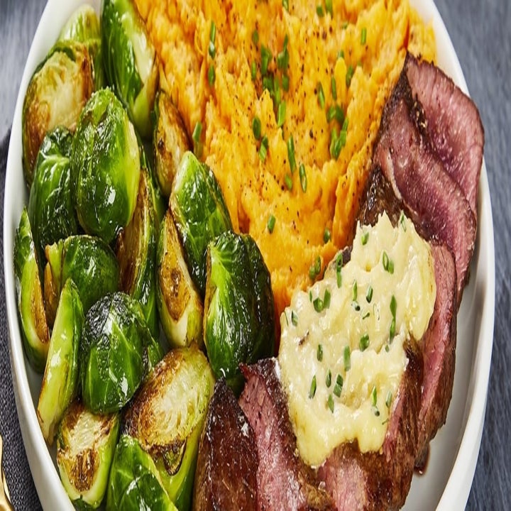 roasted garlic Brussel sprouts with steak and mashed sweet potato 