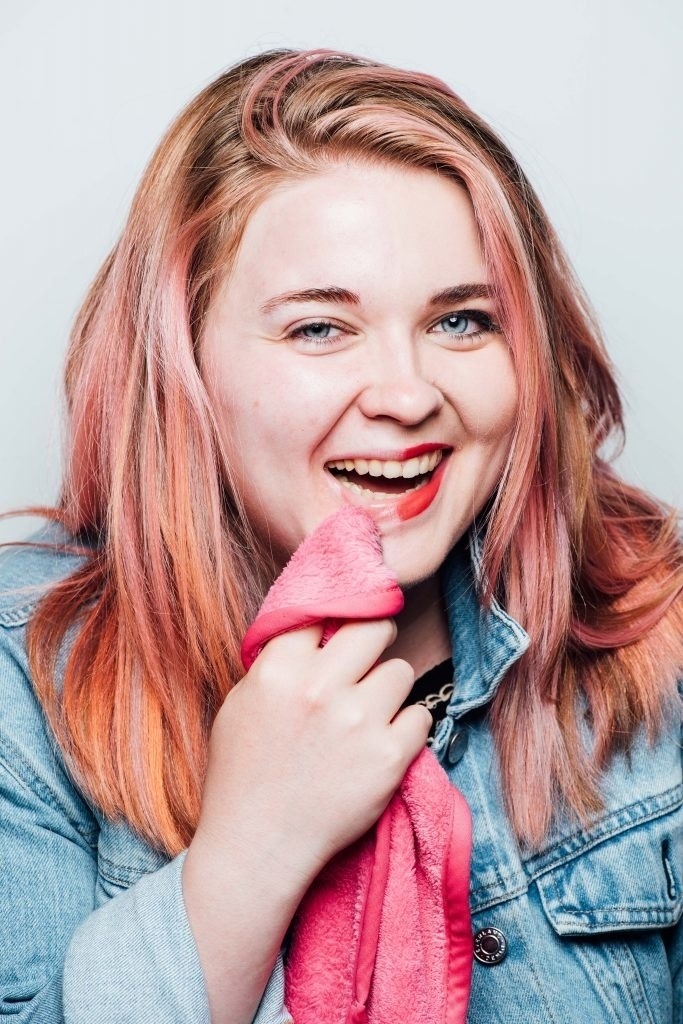 BuzzFeed staffer Jennifer Tonti wiping off makeup with pink cloth
