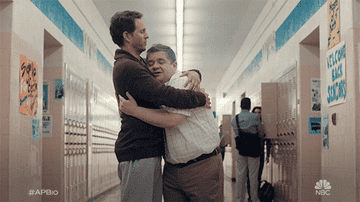 A GIF of Jack and Principal Durbin hugging and in A.P. Bio