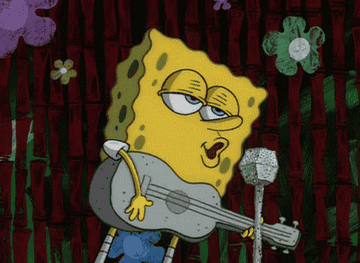 Spongebob strums his guitar and sings in a mic