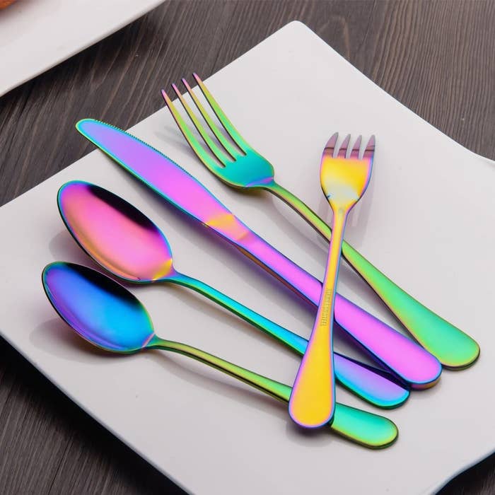 Rainbow tinted silverware on a plate 