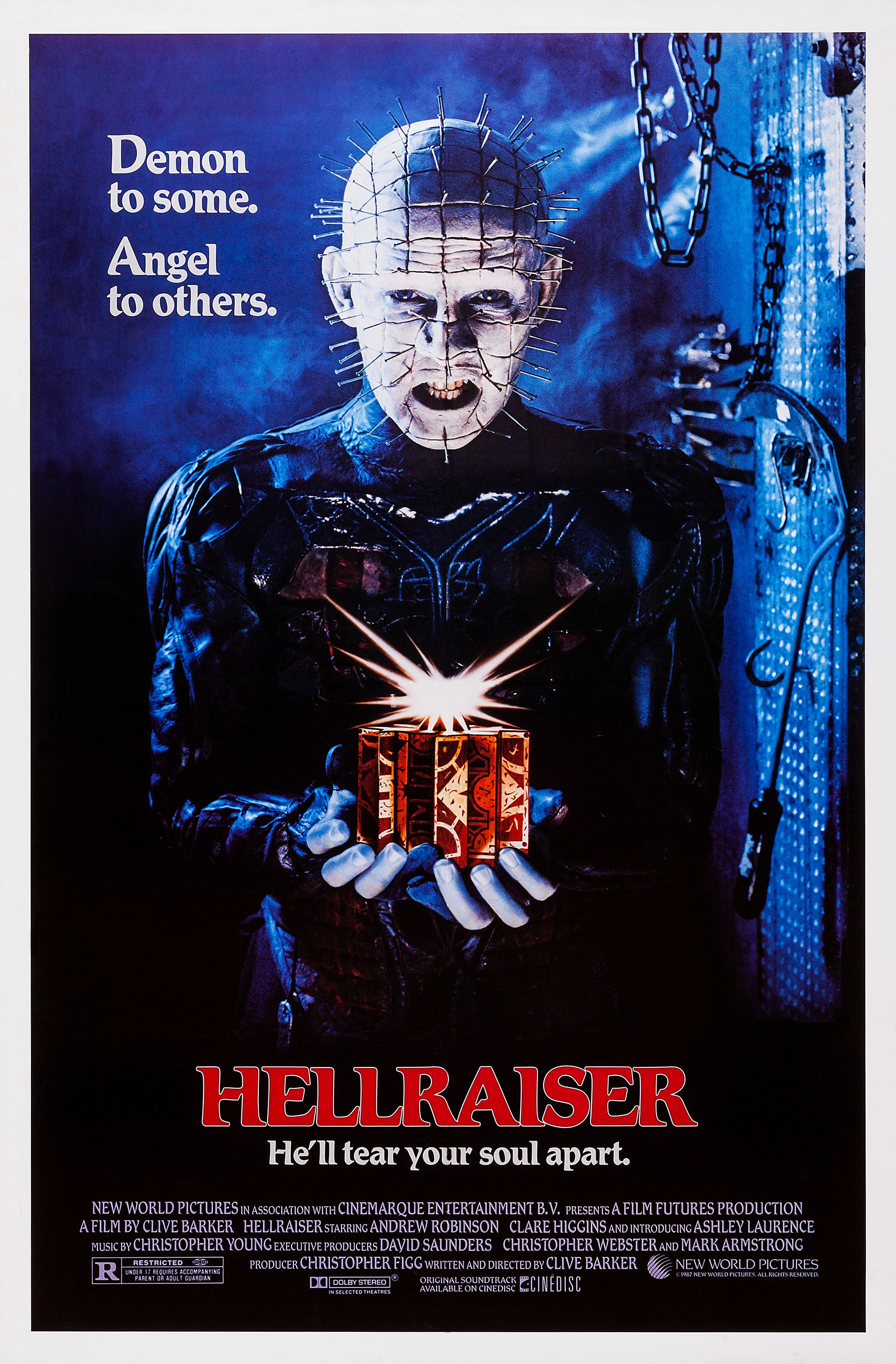 The official poster for &quot;Hellraiser&quot; which features Pinhead holding out a shiny present for you to take