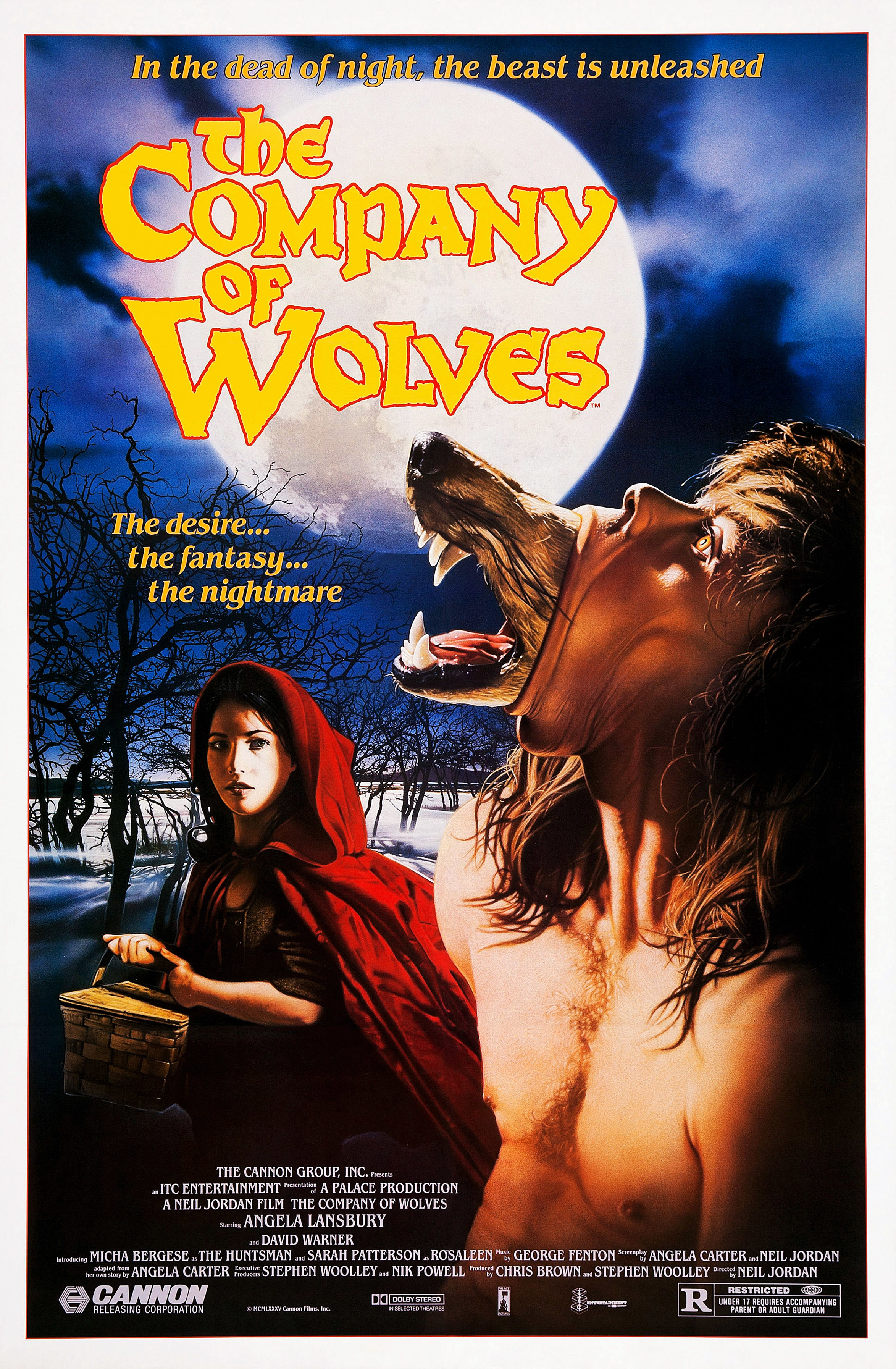 The official poster for &quot;The Company of Wolves&quot; which features a young woman dressed in a red hood looking at a man slowly transforming into a werewolf