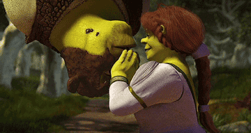 Fiona kissing Shrek, spider-man style.