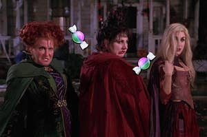 The Sanderson Sisters from Hocus Pocus surrounded by candy emojis 