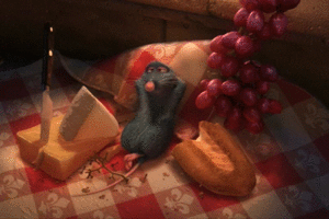 Remy from Ratatouille eating grapes and cheese and bread 