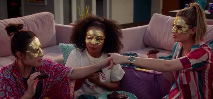 Anna, Zoey, and Nomi from &quot;Grownish&quot; wearing face masks and eating brownies. 