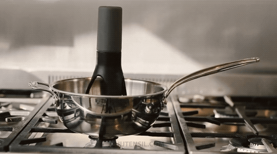 Gif of the pan stirrer moving and rotating back and forth in a sauce pan