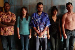 New Girl characters Winston, Jess, Nick, Cece and Schmidt standing against a wall