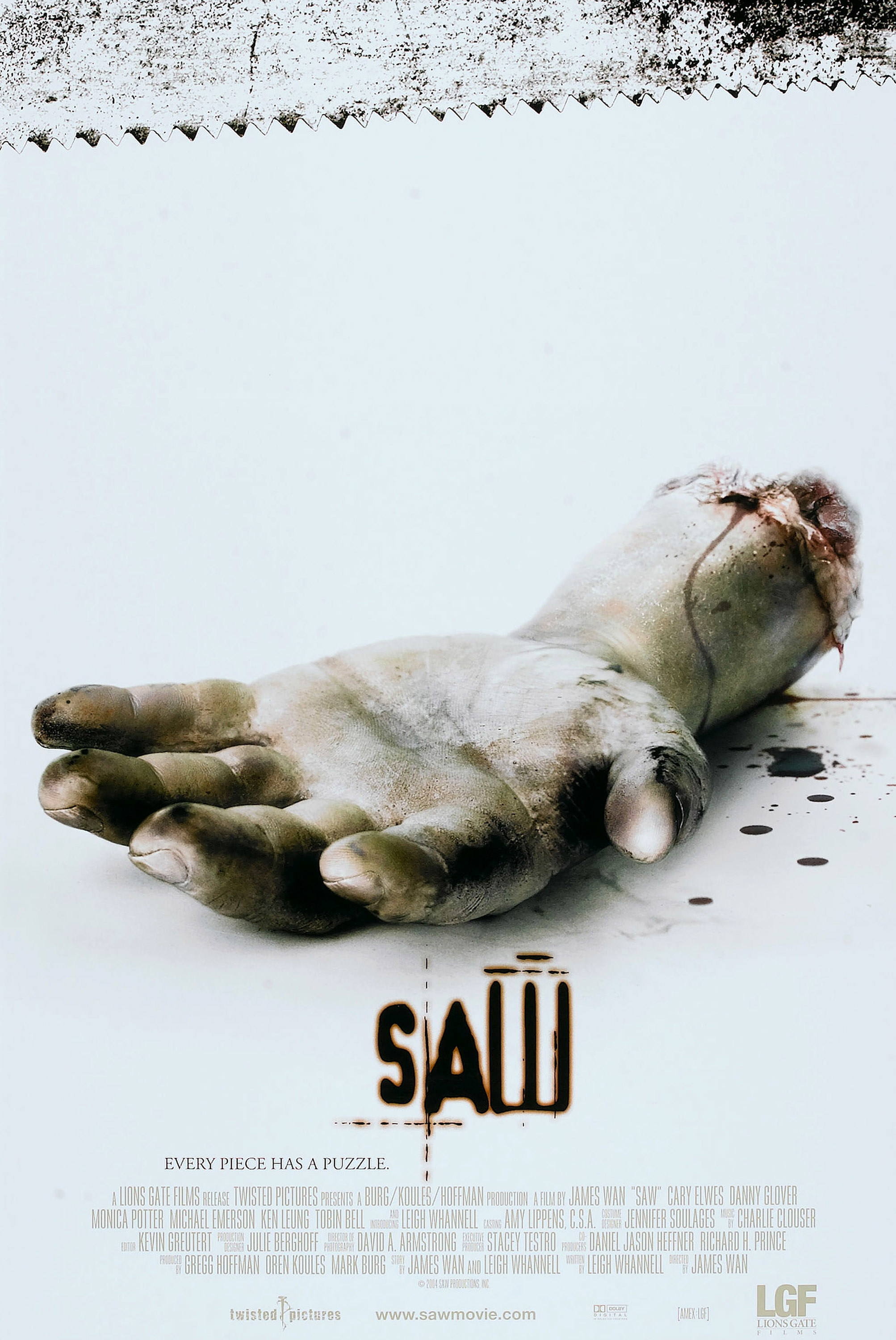 The &quot;Saw&quot; official poster featuring a rotting, cut-off hand laying on the ground