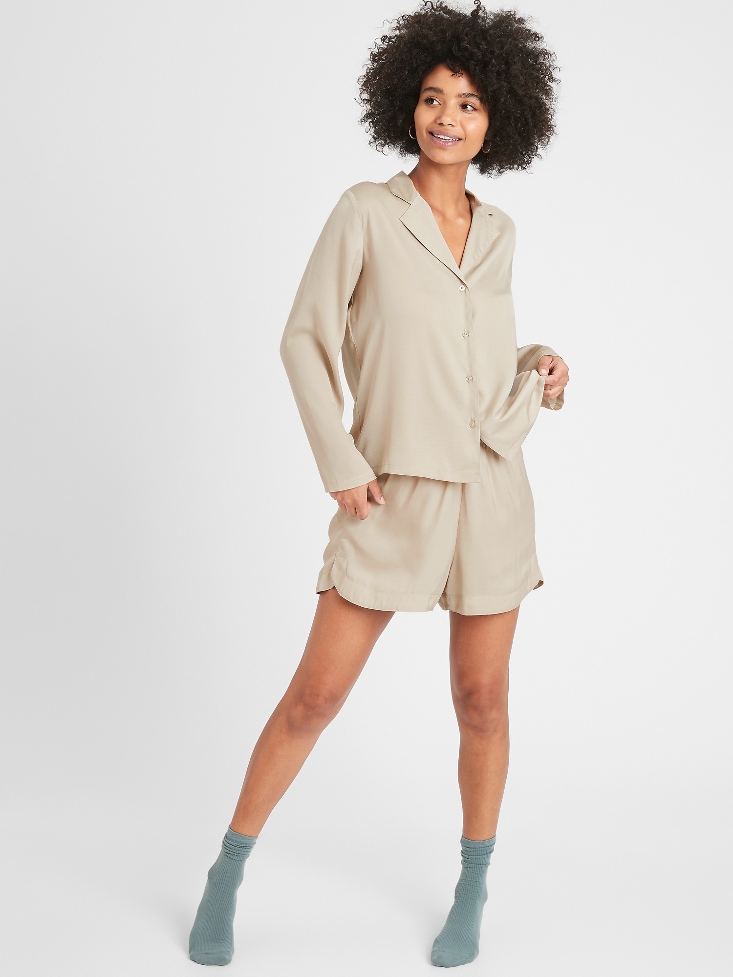 Model in the flowy PJ set in a beige-tan