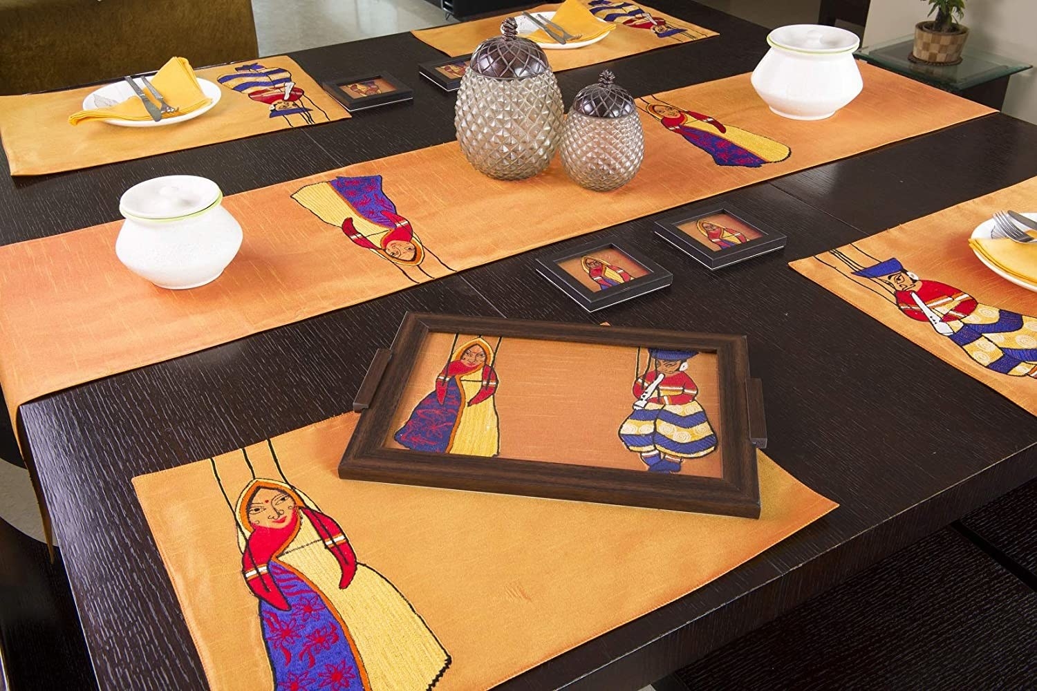 A table set up with the table runner and table mats, coasters, etc. in a similar design.