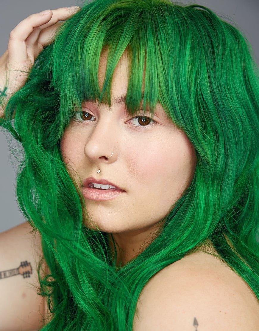 A model with brilliantly green hair after using Kowabunga