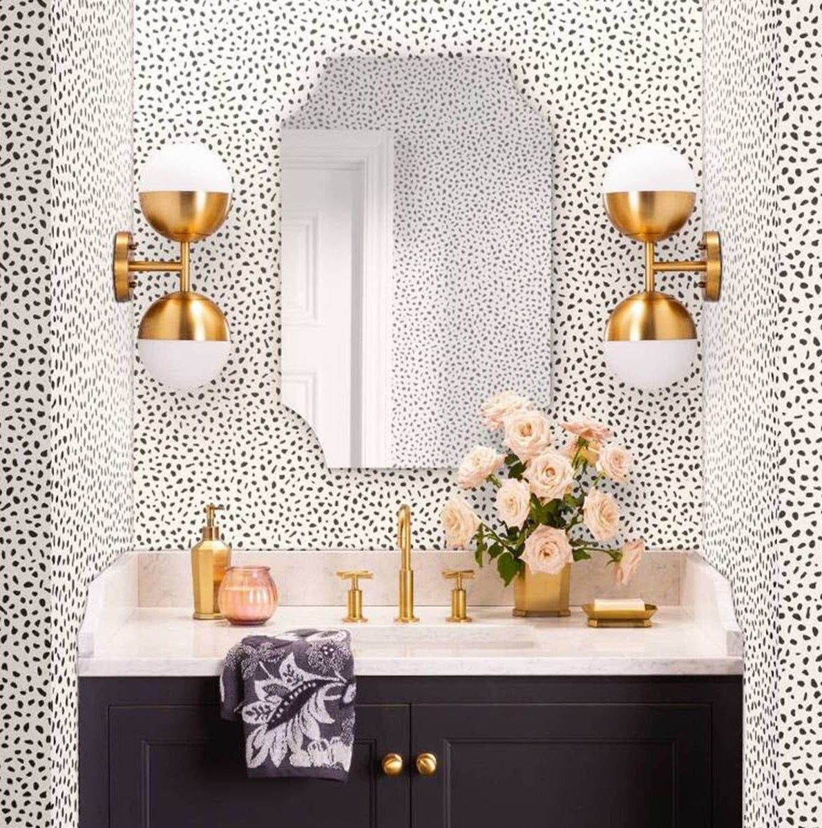 The spotted wallpaper on bathroom walls