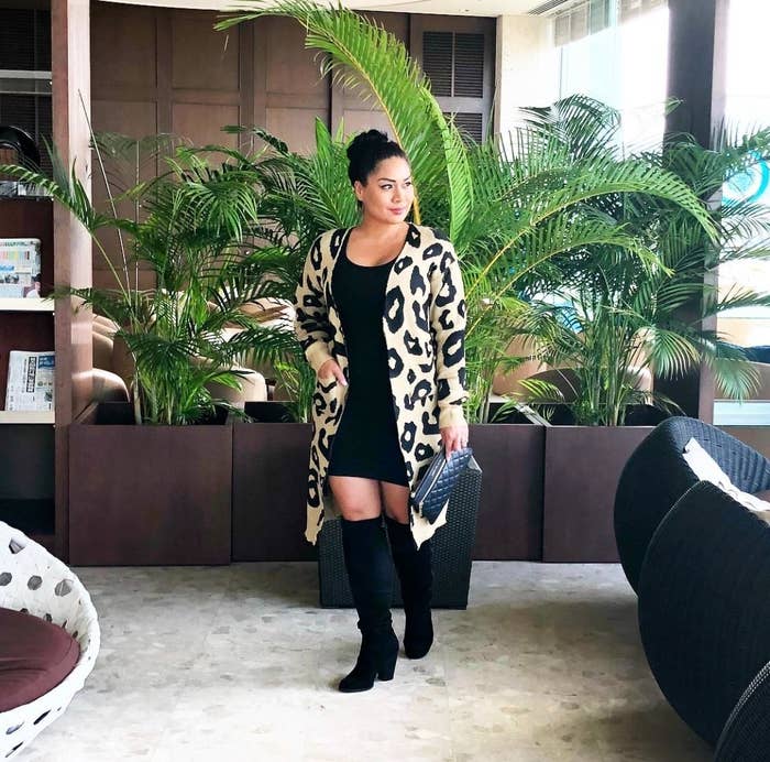 Reviewer in the beige knee-dimension cardigan with sad leopard print