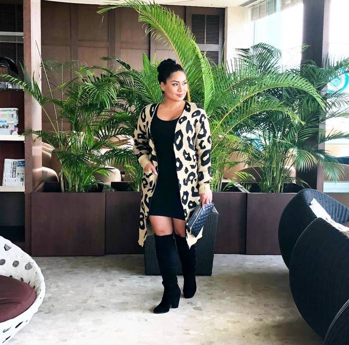 Reviewer in the beige knee-length cardigan with black leopard print