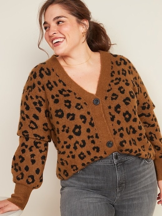 Model in the brown and black button-front v-neck cardi