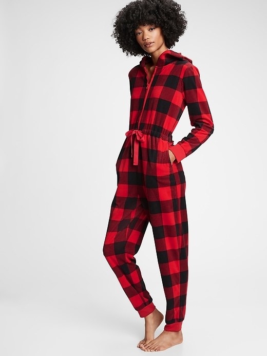 Model in the onesie with a drawstring waist