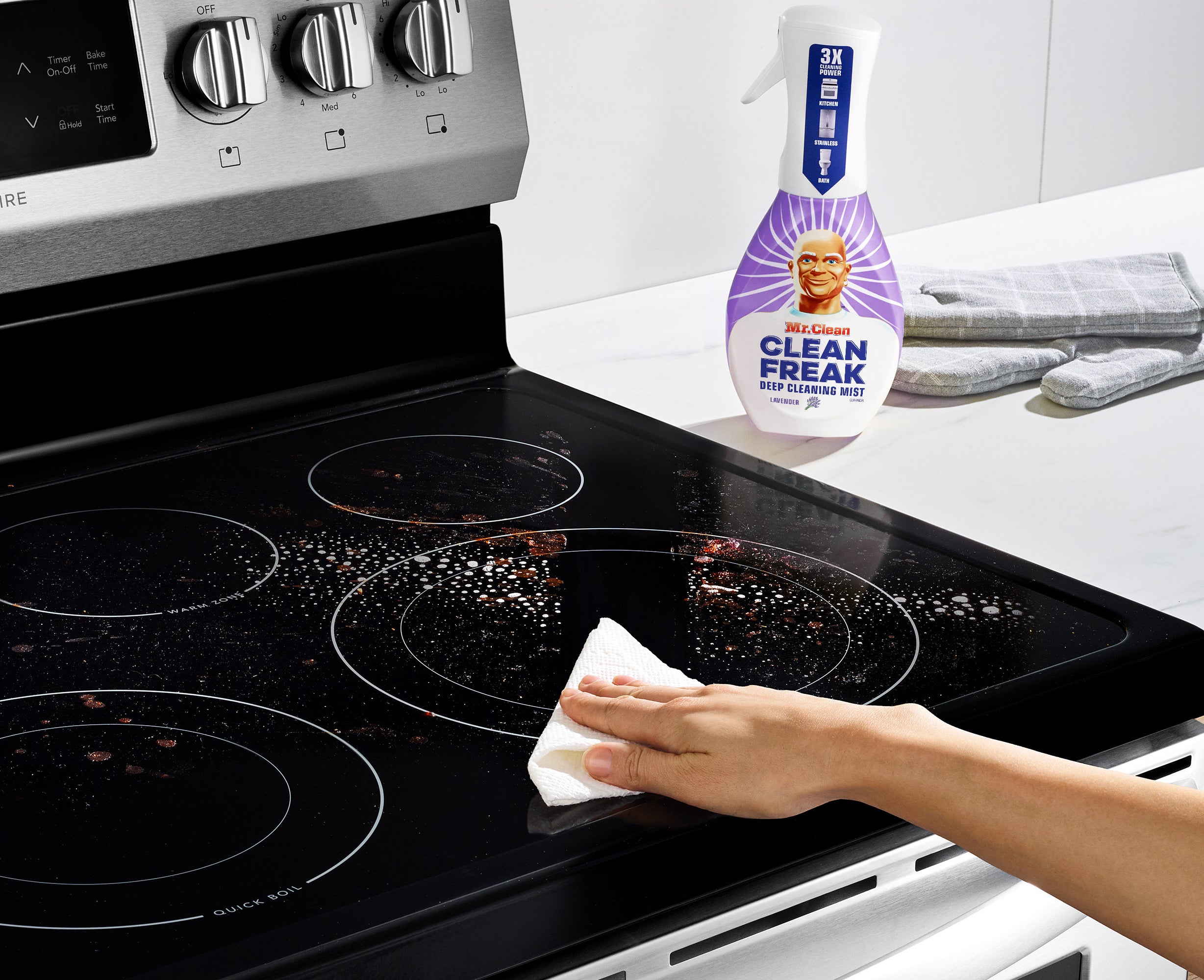 The cleaner being used on a glass cooktop