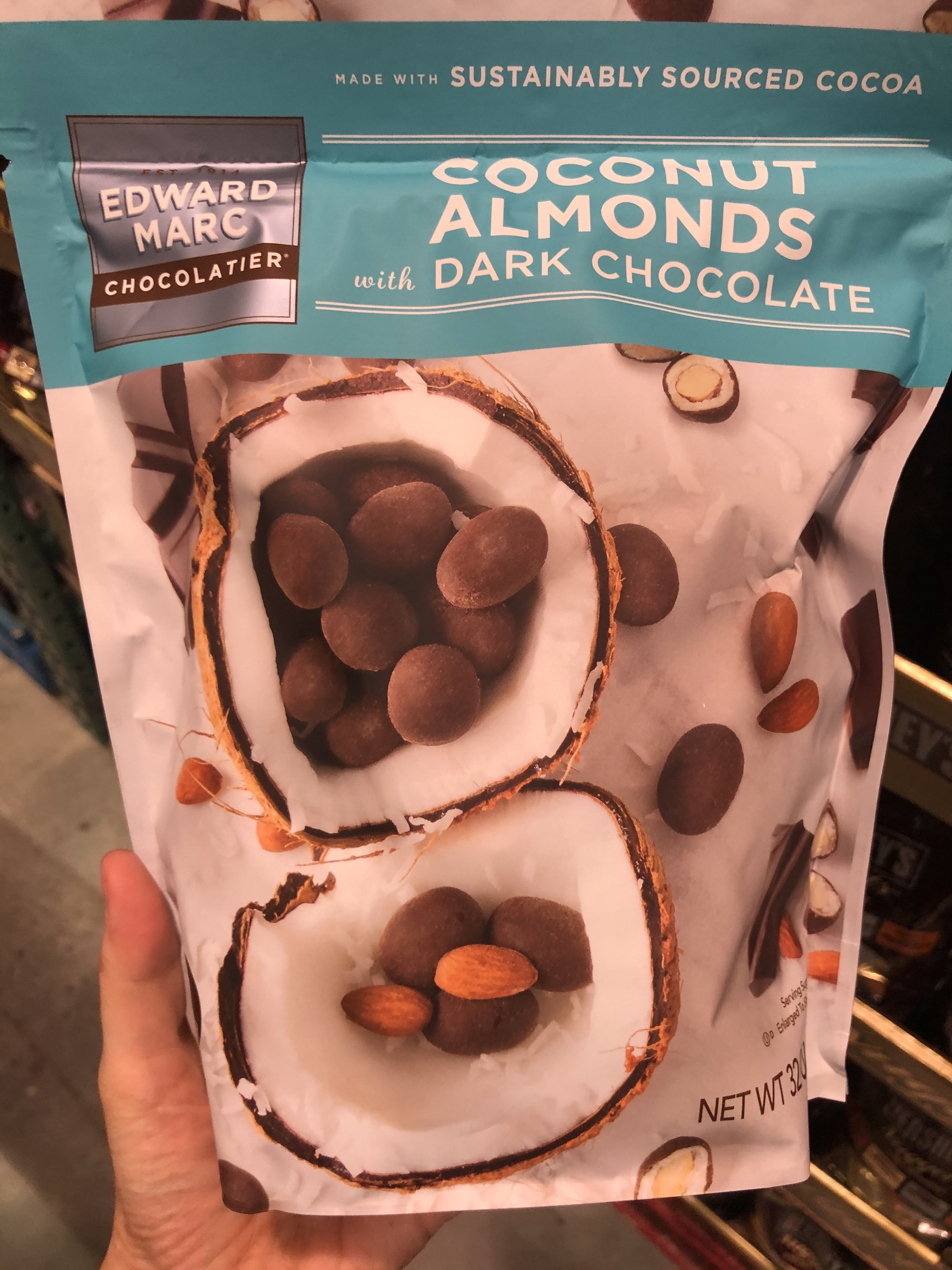 A bag of Edward Marc Chocolatier coconut almonds with dark chocolate