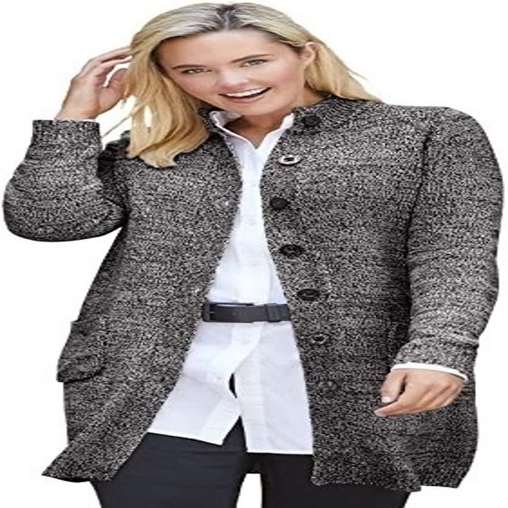 A model wearing the black/white sweater