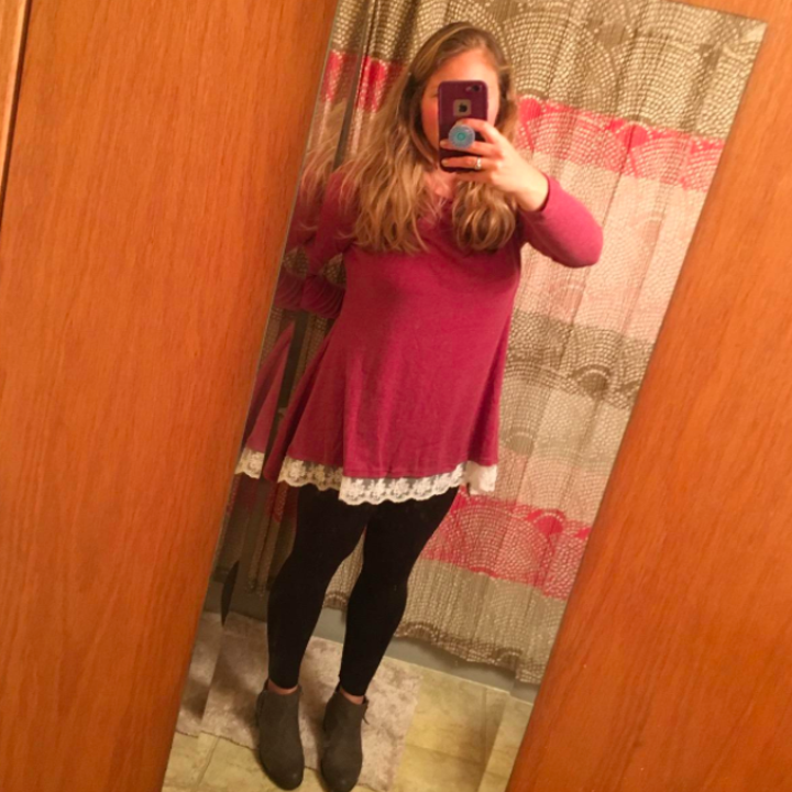 A reviewer wearing the shirt in red