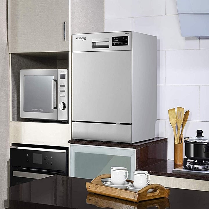 Closed dishwasher kept on a table.